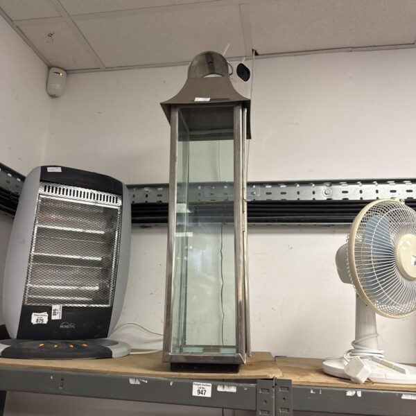 Large chrome candle lantern with glass enclosure, vintage style.