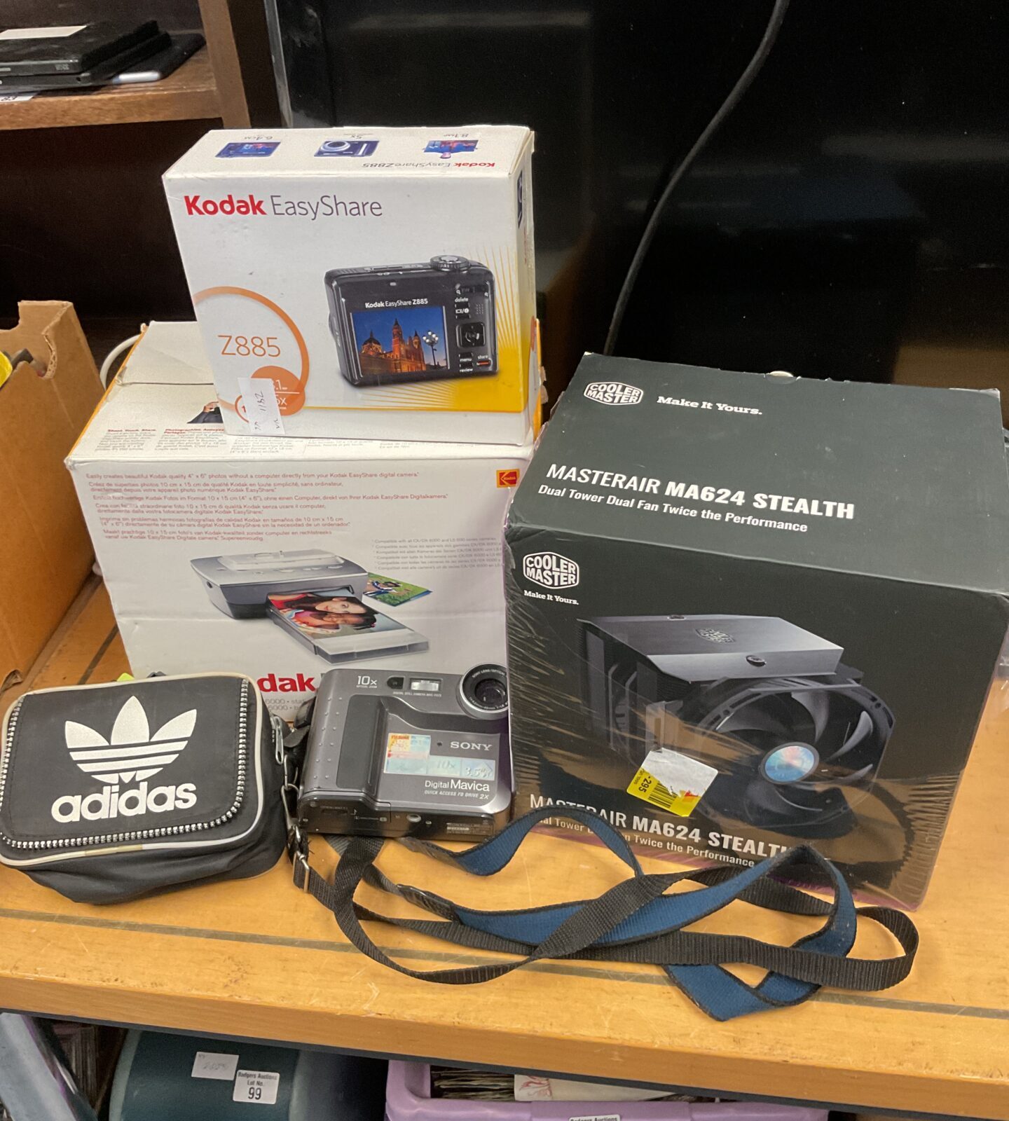Sony mavica & kodak z885 digital cameras with cooler master power supply & adidas bag of floppy disks