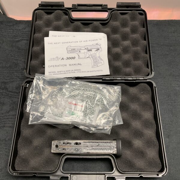 Open Umarex Ski A-3000 magazine case with magazine and manual inside.