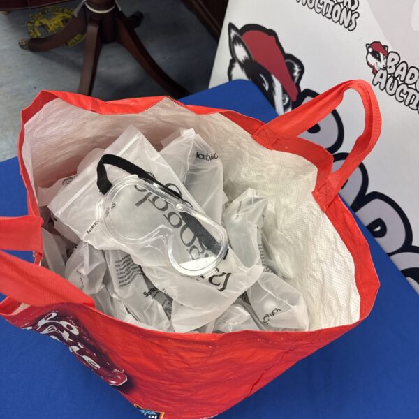 Bag of new laif safety goggles for work and industrial use.