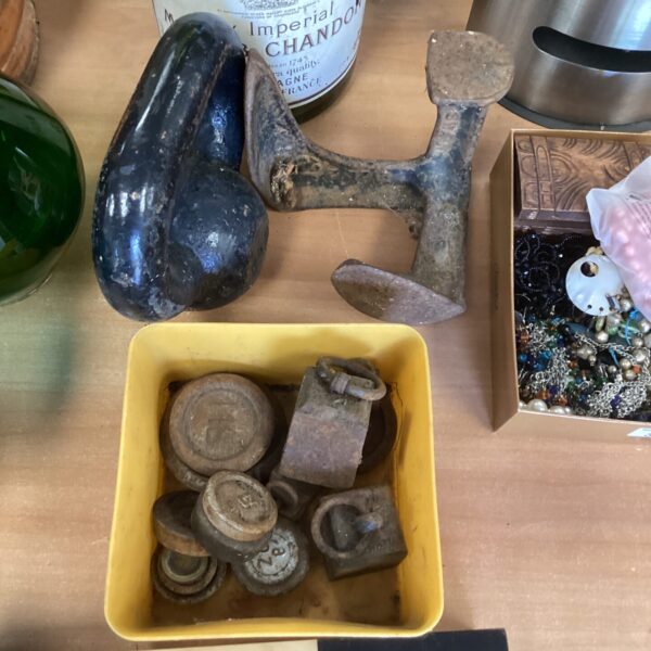 Vintage brass weights and wooden shoe last for collectors.