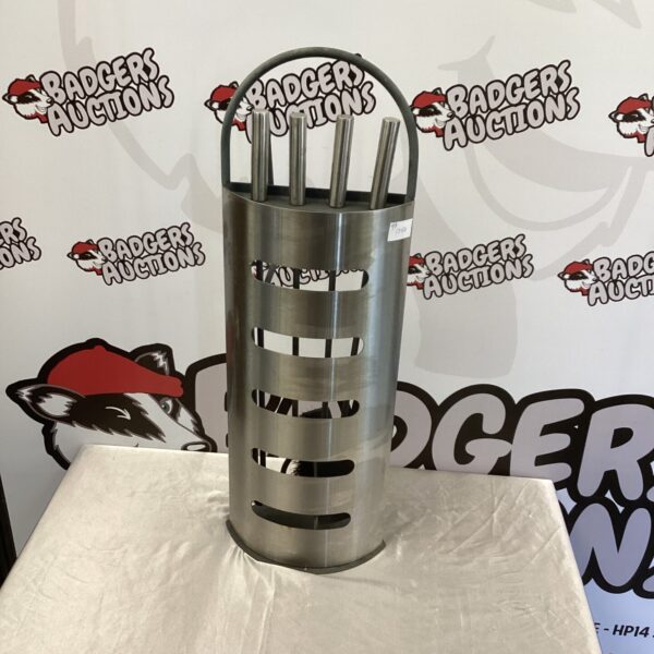 Stainless steel fireside tool set with tools in stand.