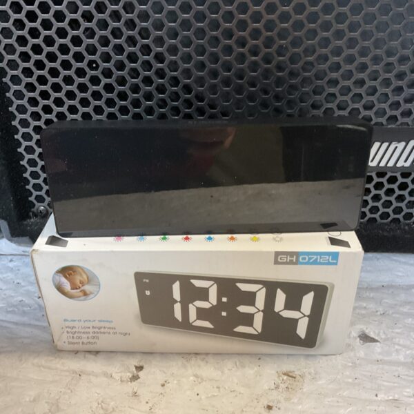 Vintage red LED digital clock displaying the time.