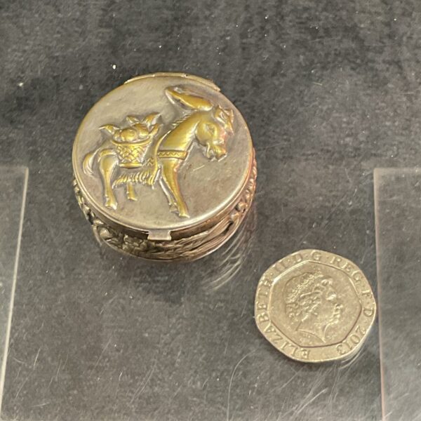 A Continental White Metal pill box with donkey decoration