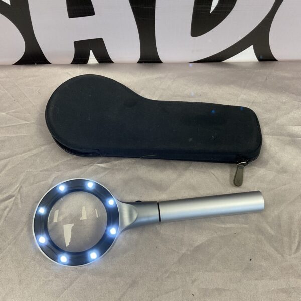 Illuminated magnifying glass with bright LED lights for close inspection.