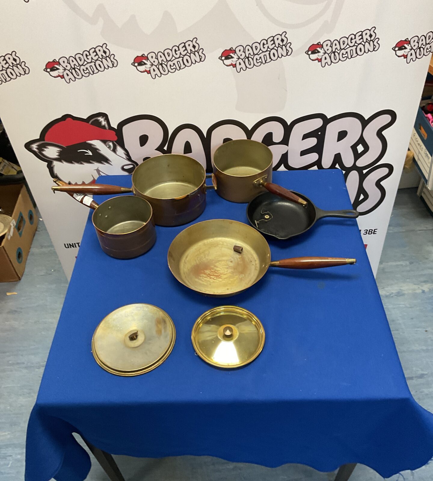 Set of copper pots and pan and cast iron pan