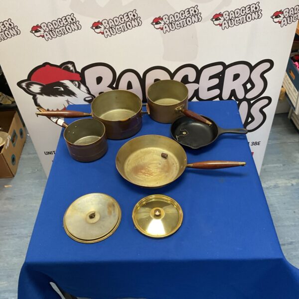 Set of copper pots and pan and cast iron pan