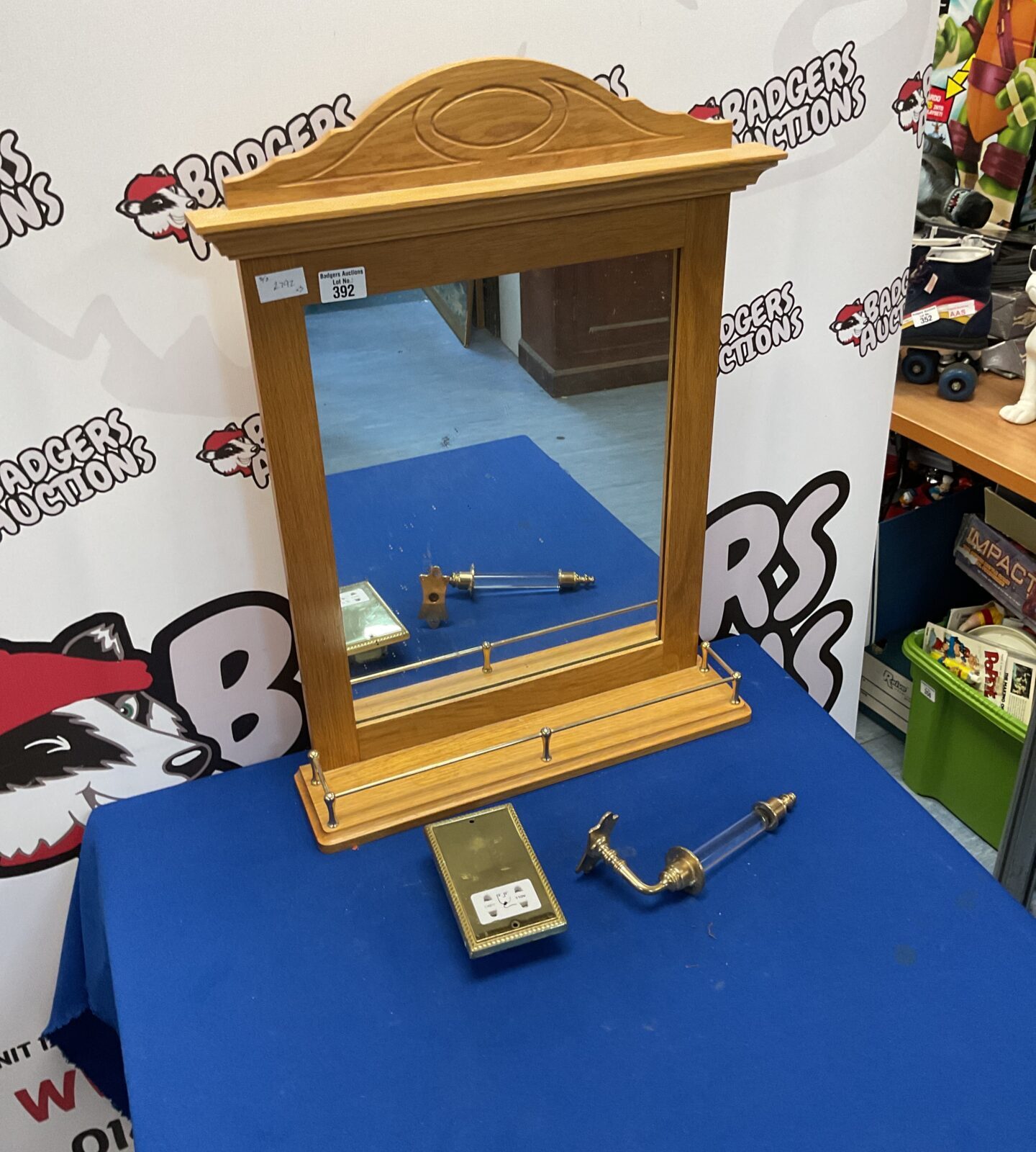 Wooden frame mirror with shaving wall socket and toilet roll holder