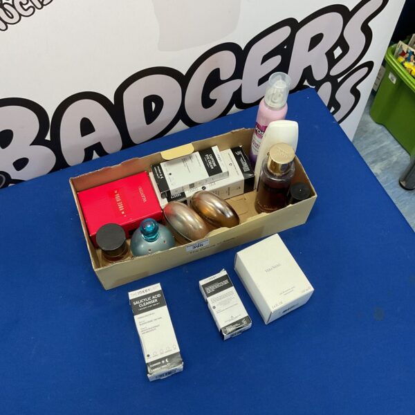 Mixed beauty product lot including perfumes and hairspray.