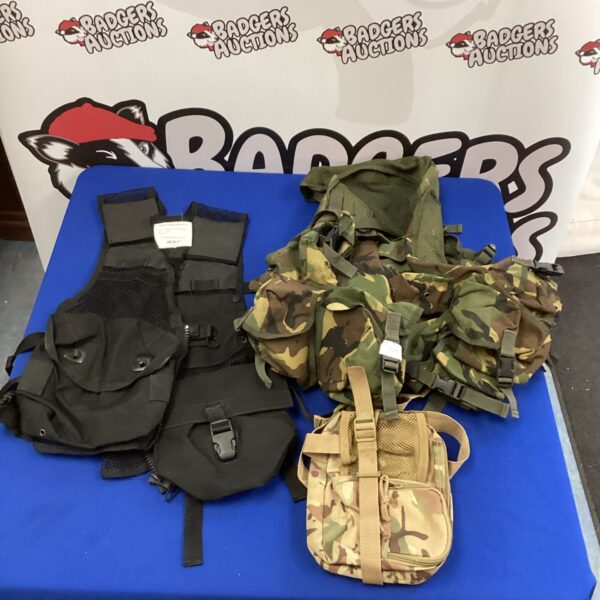 Camouflage Aegis tactical vest with adjustable straps and pouches.