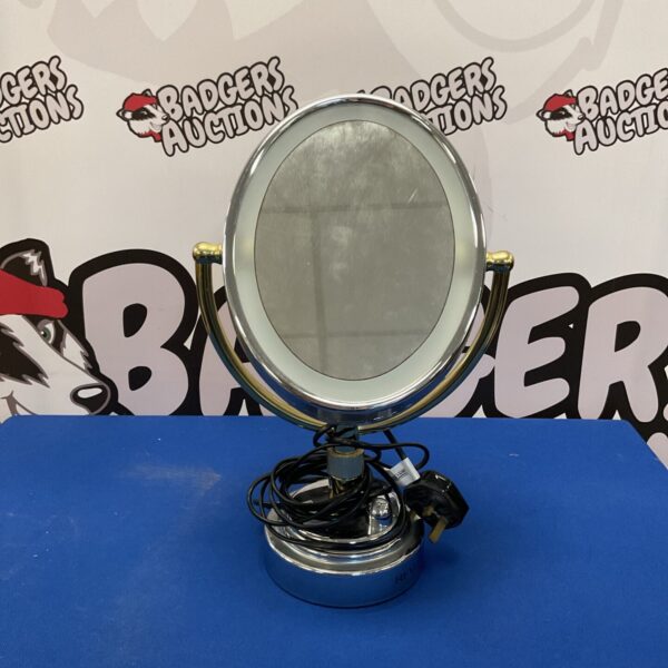 Close-up of vintage vanity mirror with adjustable neck.