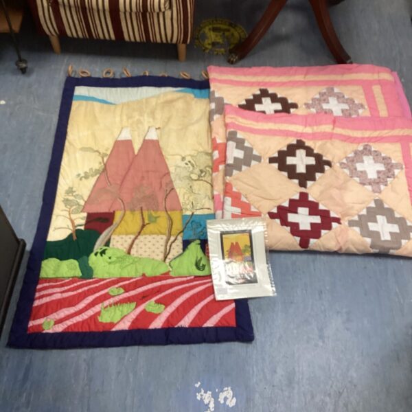 Detailed vintage quilt depicting Kent hop gardens with patchwork design.