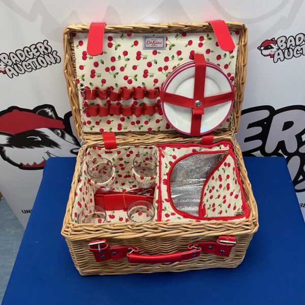 Vintage Cath Kidston picnic basket with floral lining and tableware.