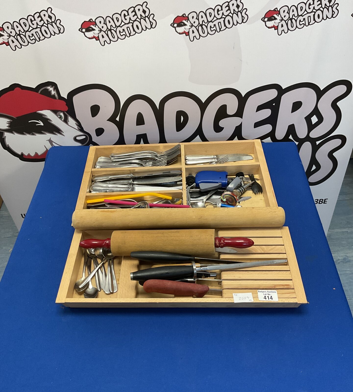 Set of cutlery in wooden drawers