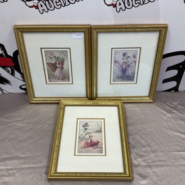 Set of three vintage Cicely Mary Barker fairy prints with floral designs.