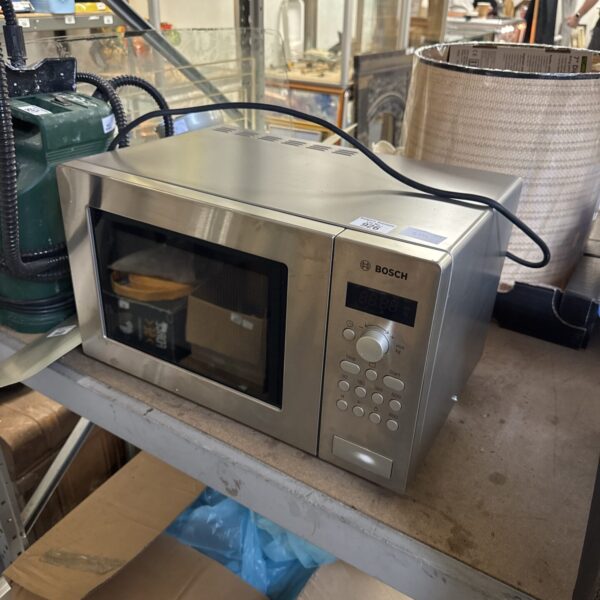 Stainless steel Bosch microwave oven in a kitchen setting.