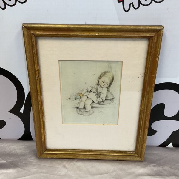 Framed Mabel Lucie Attwell print of a young girl with rosy cheeks.