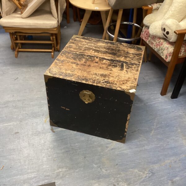 Vintage wooden chest with aged patina and rustic charm.
