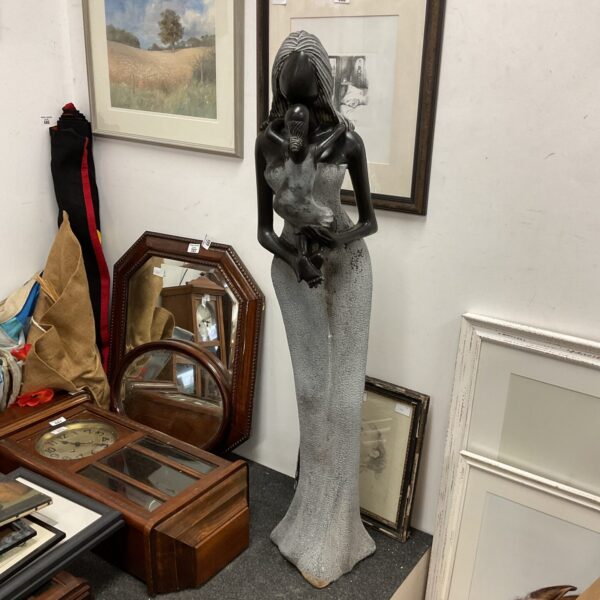Zimbabwe Shona sculpture of a mother and child, detailed stone carving.