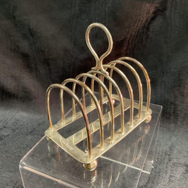 Vintage Mappin and Webb sterling silver toast rack on display.