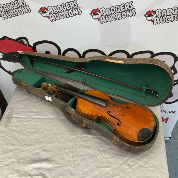 Antique 1717 Joseph Guarnerius violin in its fitted case with bow.
