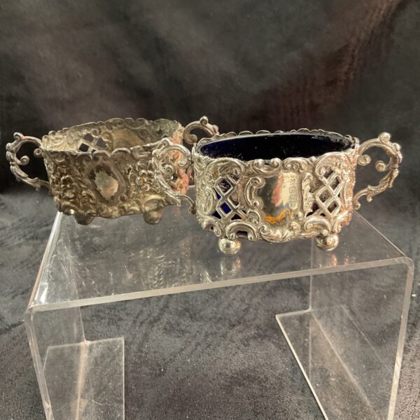 Antique silver relish pot with pierced detailing and glass liner.