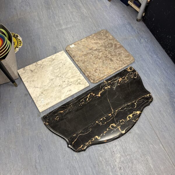 Lot of three large marble chopping boards for kitchen use.