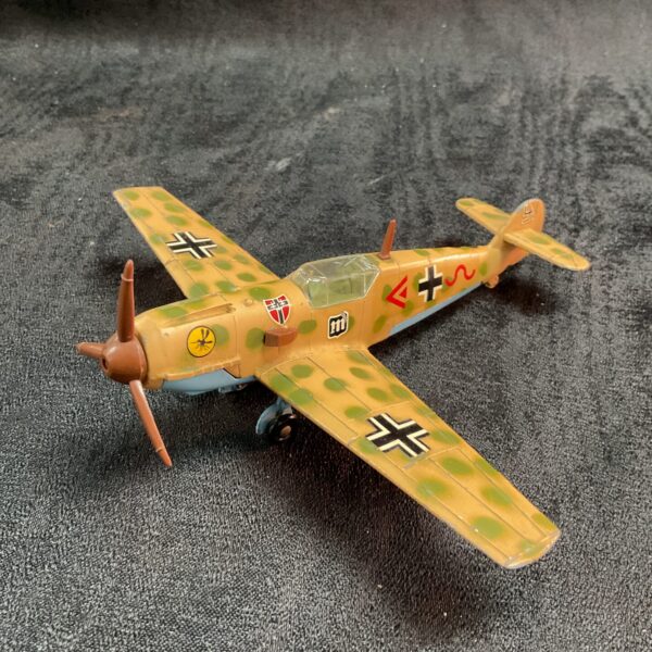 Vintage Dinky Toys Messerschmitt BF109 diecast model airplane side view.