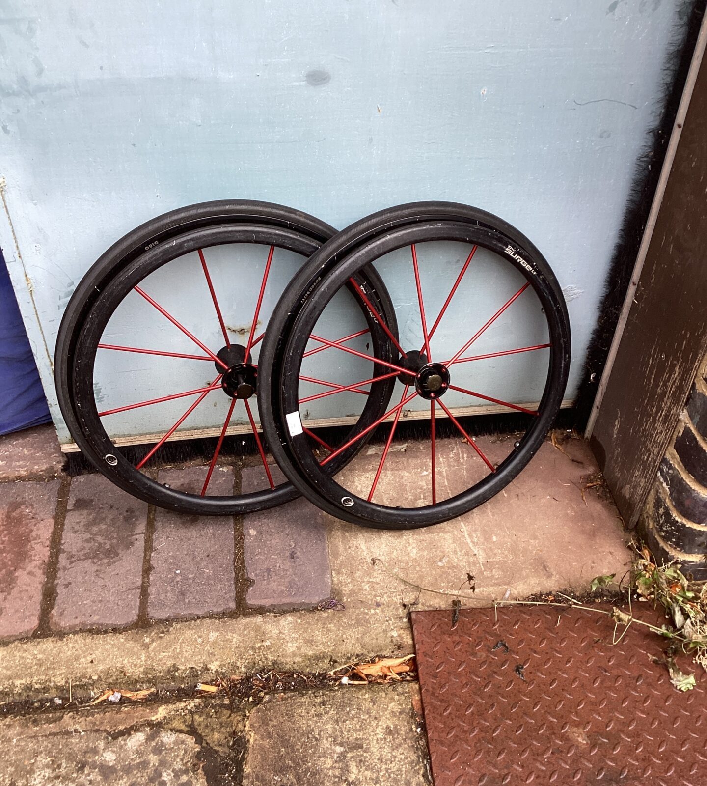 Two spare wheelchair wheels