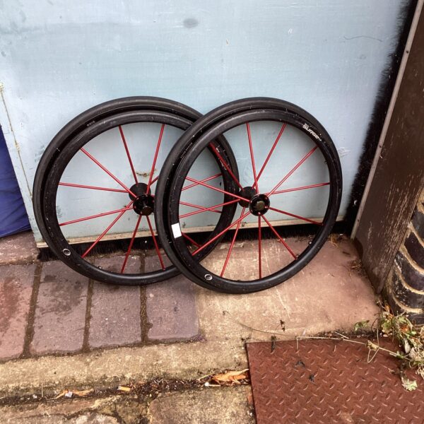 Two spare wheelchair wheels