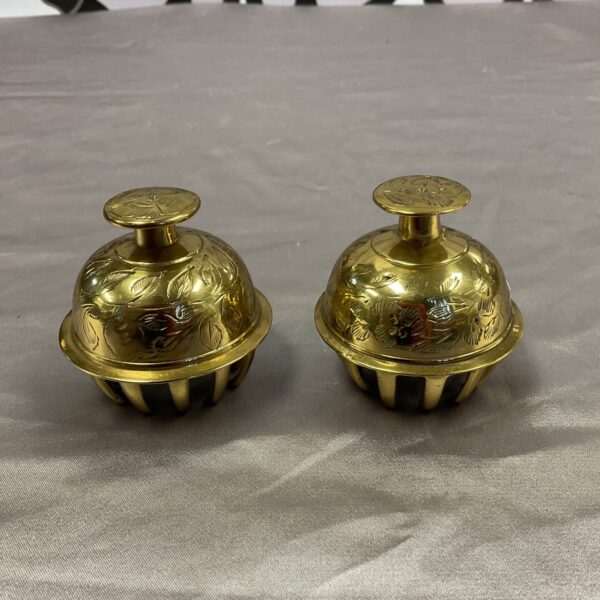 Pair of antique brass Tibetan temple bells with embossed details.