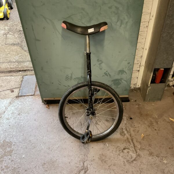 Black vintage unicycle, single wheel cycle for collectors.