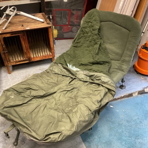 Large carp fishing bed chair showing side view.