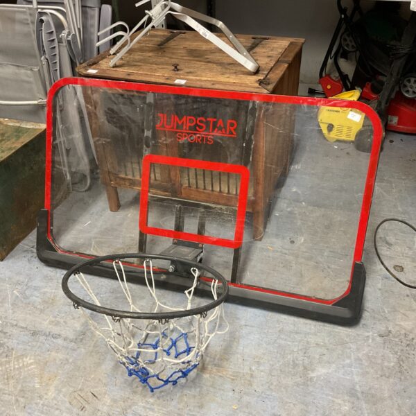 Front view of a Jumpstar basketball hoop with a clear backboard.