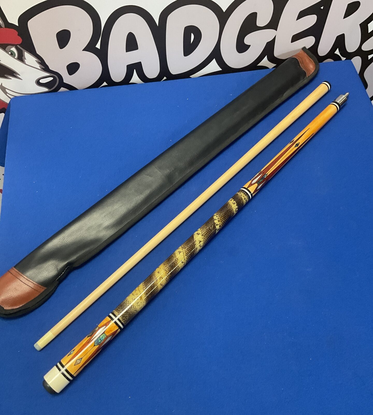 Custom made Snooker cue featuring snakeskin and abalone and mother of pearl inlay