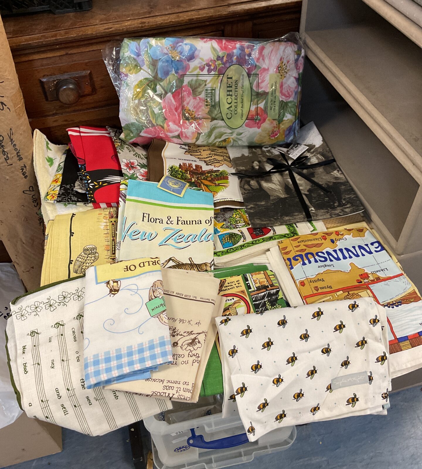 Box of new tea towels & vinyl tablecloth