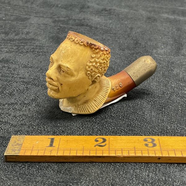 Antique meerschaum pipe bowl with carved portrait and T20 marking.