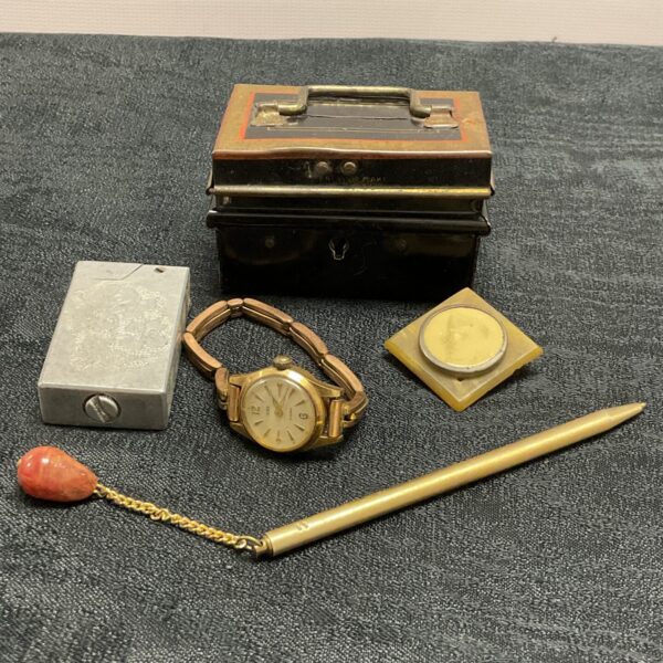 Vintage collectible lot with money box, pen watch, lighter and brooch.