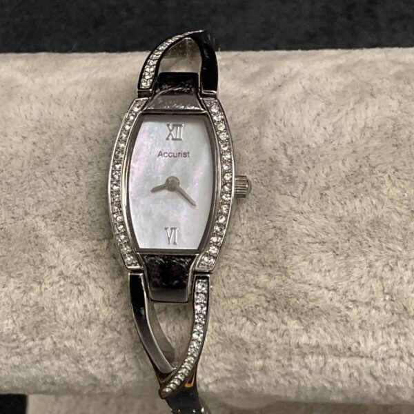 Elegant Accurist mother of pearl ladies watch with stainless steel bracelet.