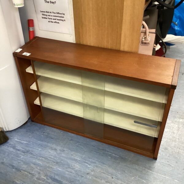 Vintage retro display cabinet with glass front for collectibles.