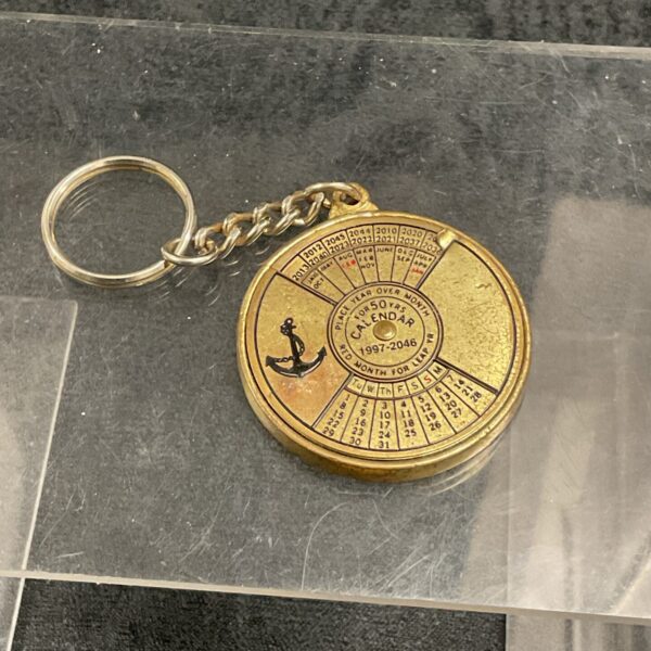 Vintage fifty year calendar keyring spanning 1997-2046.