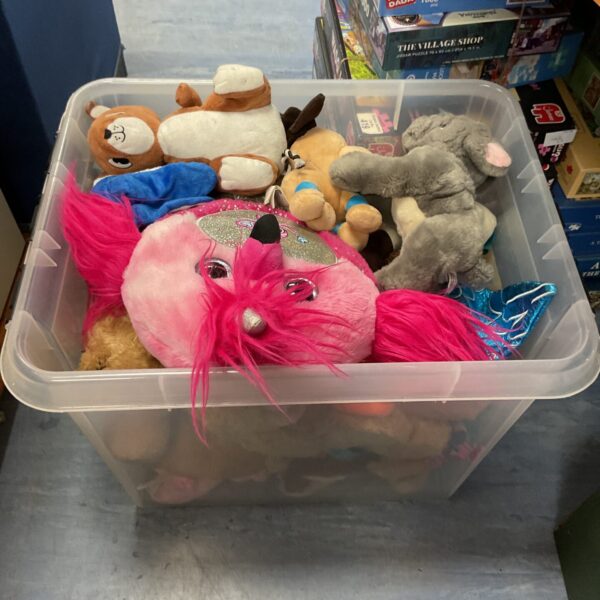 Large assortment of colourful soft toys and plush animals.