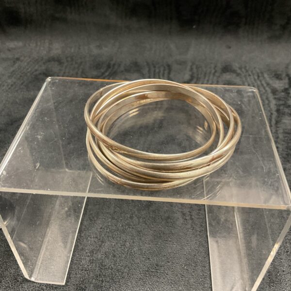 Vintage white metal interlocking bangle bracelet set.