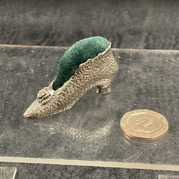 Antique French shoe pincushion, a vintage sewing collectible.