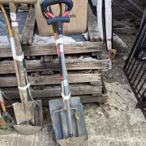 Stainless steel garden trowel with wooden handle for planting.