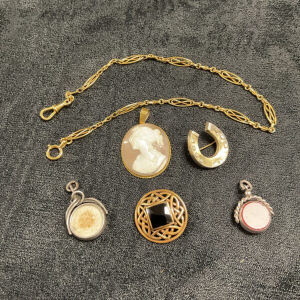 Antique jewellery and fobs lot featuring silver, Celtic and cameo designs.