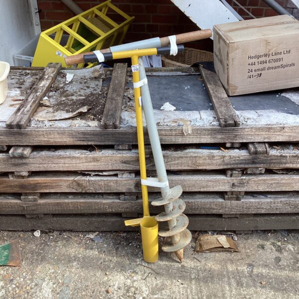 Pair of manual post hole borers for garden use.