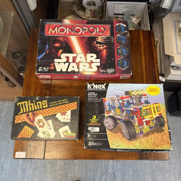 Vintage Star Wars Monopoly, Mhing card game, and K’nex truck set lot.