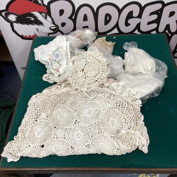 Vintage crochet lace table linens and doilies collection.