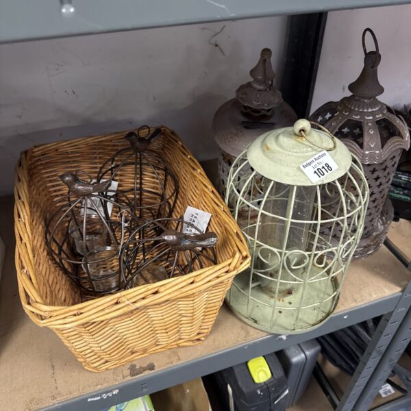 Rustic wicker basket with tea light lanterns and candle holders.